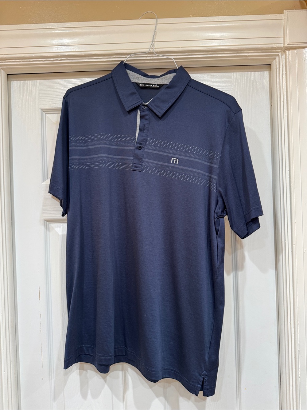 Travis Mathew Navy Polo with Subtle Chest Stripes